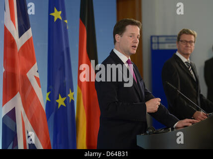 German Foreign Minister Guido Westerwelle (FDP) and British Deputy Prime Minister Nick Clegg (L) give a joint press conference at the Foreign Office in Berlin, Germany, 24 May 2012. Westerwelle continues to oppose the issue of so-called Eurobonds. Westerwelle said after a meeting with Clegg that such bonds would be astep in the wrong direction. Photo: RAINER JENSEN Stock Photo