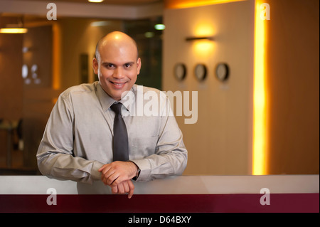 Corporate portrait of a confident Indian business executive smiling Stock Photo