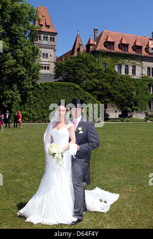 Newly wed Melissa Eliyesil and Count Charles von Faber-Castell pose in front of the castle of the Faber-Castell family near Nuremberg, Germany, 26 May 2012. Besides relatives and close friends, guests from different parts of the world attend the ceremony. Photo: Albert Nieboer Stock Photo