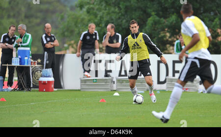 German national soccer player Miroslav Klose (C) plays the ball during a training session in Tourrettes, France, 29 May 2012. The German national soccer team is currently preparing for the UEFA Europen Soccer Championship 2012 in a training camp in the south of France. Photo: Andreas Gebert Stock Photo