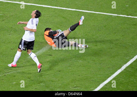 Israel's gaolkeeper Ariel Harush catches the ball next to Germany's Mesut Oezil during the international friendly soccer match Germany vs Israel at Red Bull Arena in Leipzig, Germany, 31 May 2012. Photo: Jan Woitas dpa/lsn  +++(c) dpa - Bildfunk+++ Stock Photo