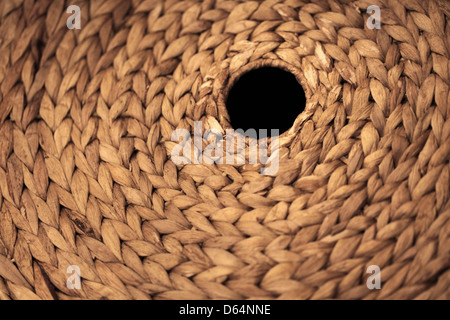 Background with round braided element with hole, selective focus Stock Photo