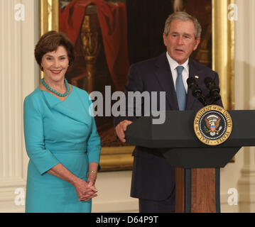 Former United States President George W. Bush speaks at the unveiling ceremony of his and former first lady Laura Bush's official White House portraits during a ceremony Thursday, May 31, 2012 at the White House in Washington, DC. .Credit: Chris Kleponis / CNP Stock Photo