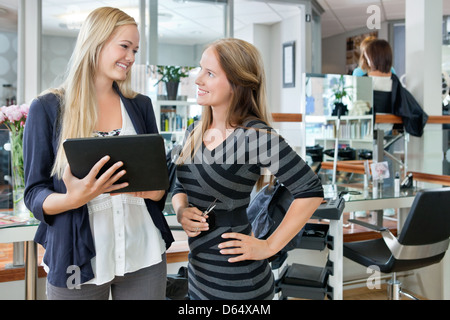 Female Customer With Digital Tablet Stock Photo