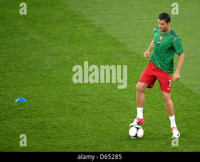 Portugal's Cristiano Ronaldo warms up before UEFA EURO 2012 group B soccer match Germany vs Portugal at Arena Lviv in Lviv, the Ukraine, 09 June 2012. Photo: Marcus Brandt dpa (Please refer to chapters 7 and 8 of http://dpaq.de/Ziovh for UEFA Euro 2012 Terms & Conditions)  +++(c) dpa - Bildfunk+++ Stock Photo