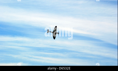 spitfire flying clouds blue sky Stock Photo