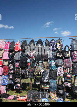This image features a variety of brightly colored backpacks designed for school use, showcasing different styles and sizes. The backpacks are durable, practical, and suitable for carrying school supplies. Stock Photo