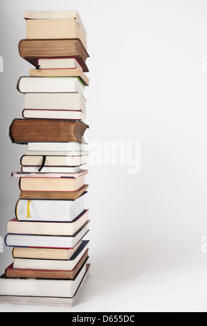 A pile of traditional colorful books, different sizes, big and small, thin and thick books Stock Photo