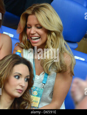 Sylvie van der Vaart, wife of the Netherlands' Rafael van der Vaart, jokes before UEFA EURO 2012 group B soccer match Netherlands vs Germany at Metalist Stadium in Kharkiv, the Ukraine, 13 June 2012. Photo: Marcus Brandt dpa (Please refer to chapters 7 and 8 of http://dpaq.de/Ziovh for UEFA Euro 2012 Terms & Conditions) Stock Photo