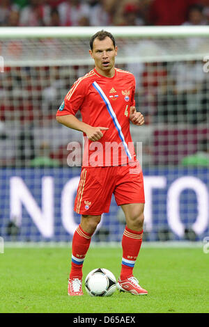 Russia's Sergei Ignashevich kicks the ball during the Euro 2012 match between Poland and Russia at the National Stadium in Warsaw, Poland, 12 June 2012. Photo: Revierfoto Stock Photo
