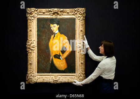 London, UK. 12th April 2013. A Sotheby's employee poses in front of Amedeo Modigliani  'L'Amazone' (Est. $20-30 million). The work will go on sale at Sotheby’s New York in May 2013. The Blockbuster sales at include works by Richter, Modigliani, Picasso, Rodin, Bacon, Cezanne. Credit: Piero Cruciatti / Alamy Live News Stock Photo