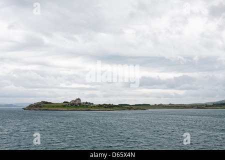 Duart Castle on the island of Mull, seen from a ferry from Oban to Craignure. Stock Photo