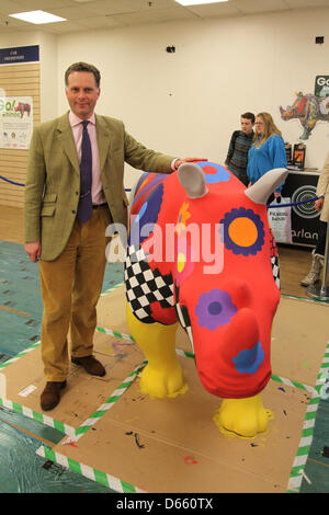 Southampton, UK. 12th April 2013 - James Cretney, Chief Executive of Marwell Wildlife with one of the Go! Rhinos sculptures at Marlands Shopping Centre. The finished Rhinos will be displayed on sculpture trails throughout the city this summer from July to September before moving to Marwell Zoo in October where they will be sold at auction. Proceeds will benefit Marwell Wildlife, Wessex Heartbeat's High 5 Appeal and The Rose Road Association. Credit: Rob Arnold/Alamy Live News Stock Photo