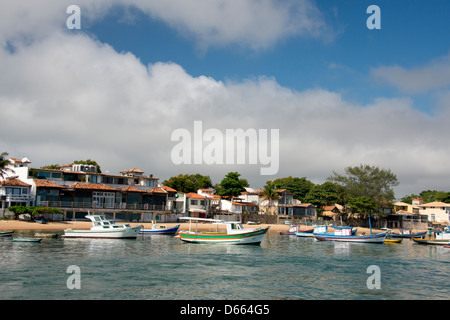 Brazil, state of Rio de Janeiro, Buzios. Local fishing boats along waterfront beach. Stock Photo
