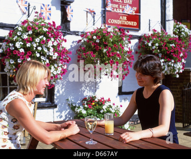 Young women chatting and drinking in beer garden, Bracknell, Berkshire, England, United Kingdom Stock Photo
