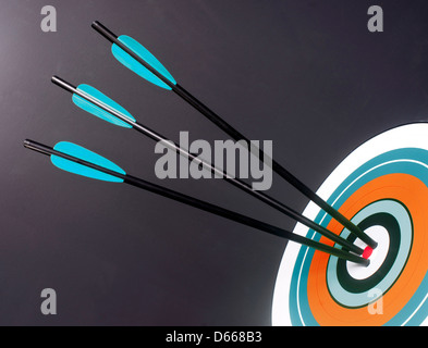 Three Blue Black Archery Arrows Hit Round Target Bullseye Center Stock ...