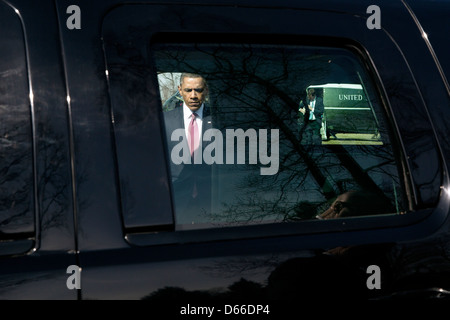 US President Barack Obama walks from Marine One to the waiting motorcade after arriving at the Walter Reed National Military Medical Center landing zone March 5, 2013 in Bethesda, MD. The President met with service members at Walter Reed National Military Medical Center, awarding two Purple Hearts and a promotion ceremony during his visit. Stock Photo