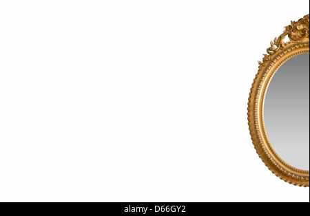 An ornate golden mirror on a white background. Stock Photo