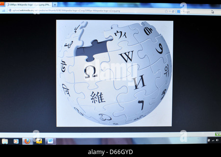 Image of a computer screen showing the Wikipedia logo. Stock Photo