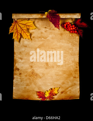 Old paper with autumn leaves on black background isolated Stock Photo