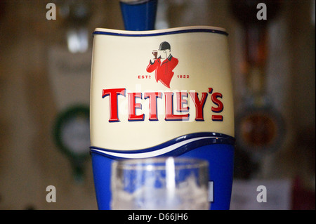 A Tetleys bitter pump clip on a bar