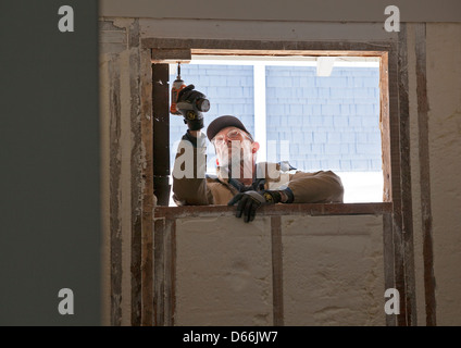 A foreclosed house gets a complete makeover in every room, including new windows in this bathroom. Stock Photo