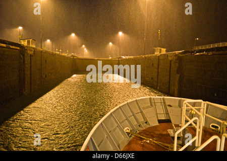 The Panama Canal, with its 48-mile ship canal in Panama, connects the Atlantic Ocean to the Pacific Ocean. Stock Photo