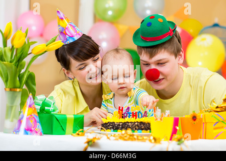 family celebrating first baby's birthday Stock Photo