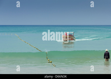 Parasail speedboat comes ashore in Thailand Stock Photo