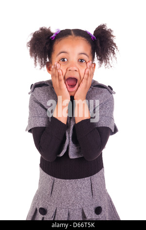 young African girl sticking tongue out, isolated on white background Stock Photo