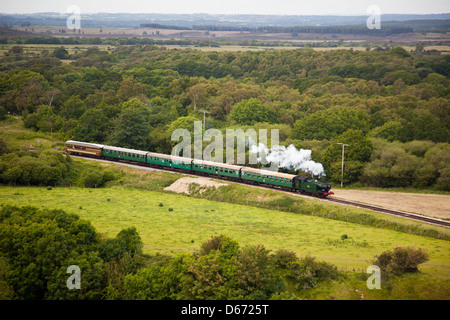 Ex GWR 0-6-2T No.6695 passes below Corfe Castle on the preserved Swanage Railway Dorset England UK Stock Photo