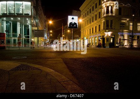 A night time view of Checkpoint Charlie in Berlin, Germany Stock Photo