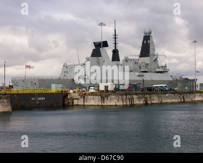 Type 45 Destroyer HMS Defender D36, Berthed alopngside Middle slip jetty in Portsmouth Dockyard, England Stock Photo