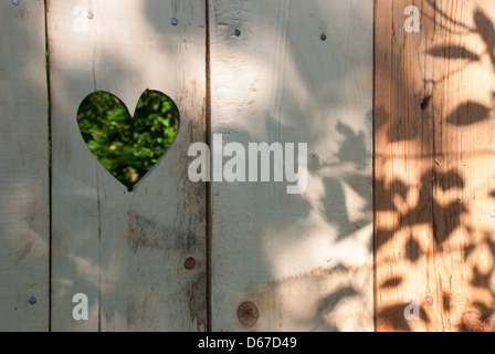 Heart shape in wooden door Stock Photo