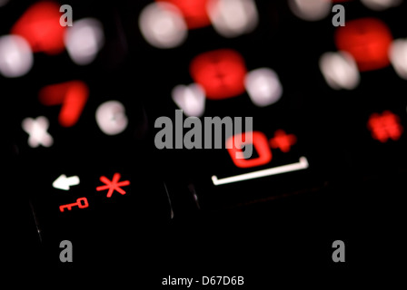 Close up of red and white numbers and symbols on sign Stock Photo