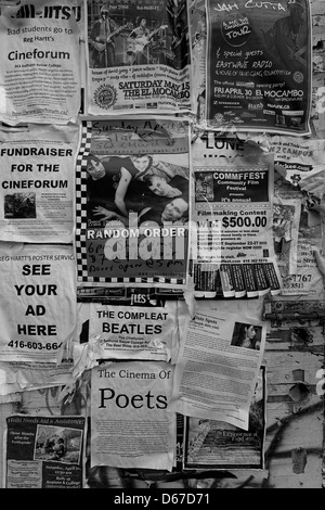 Black and white of fliers (flyers) or handbills posted on a wall Stock Photo