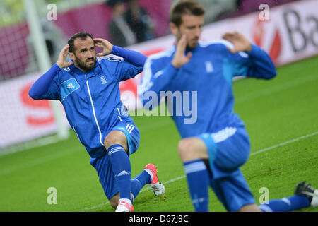 Greece's Theofanis Gekas does some stretching during a training session of the Greece national soccer team at Arena Gdansk in Gdansk, Poland, 21 June 2012. Photo: Andreas Gebert dpa (Please refer to chapters 7 and 8 of http://dpaq.de/Ziovh for UEFA Euro 2012 Terms & Conditions)  +++(c) dpa - Bildfunk+++ Stock Photo