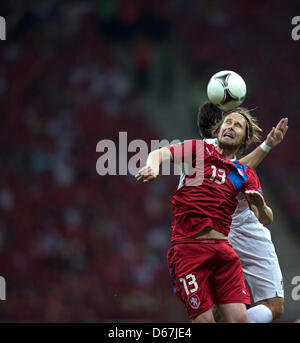 Czech Republic's Jaroslav Plasil (front) vies for the ball during UEFA EURO 2012 quarter-final soccer match Czech Republic vs Portugal at the National Stadium in Warsaw, Poland, 21 June 2012. Photo: Jens Wolf dpa (Please refer to chapters 7 and 8 of http://dpaq.de/Ziovh for UEFA Euro 2012 Terms & Conditions) Stock Photo