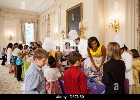 First Lady Michelle Obama joins children in making Mother's Day gifts in the State Dining Room of the White House in Washington, D.C., May 10, 2012. .Mandatory Credit: Sonya N. Hebert - White House via CNP Stock Photo