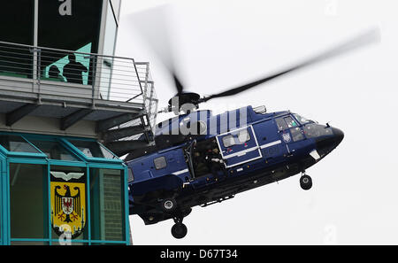 A Eurocopter AS 332 Super Puma helicopter takes part in an exercise in which members of police special force GSG9 are deposited at a pretend place of action at the site of the flying squadron of the German Fedral Police in Blumber, Germany, 27 June 2012. Photo: Hannibal Hanschke Stock Photo