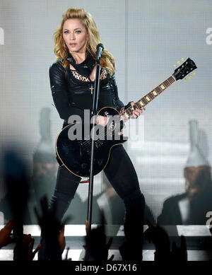 American singer Madonna performs on the stage at O2 World in Berlin, Germany, 28 June 2012. The popstar gave her first concert in Germany as part of her 2012 'MDNA' world tour. Photo: Britta Pedersen Stock Photo