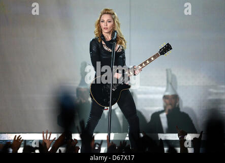 American singer Madonna performs on the stage at O2 World in Berlin, Germany, 28 June 2012. The popstar gave her first concert in Germany as part of her 2012 'MDNA' world tour. Photo: Britta Pedersen Stock Photo