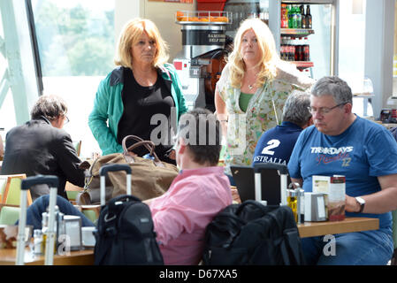 Daniela Loew (R), wife of Germany's head coach Joachim Loew, waits to board the return flight from Warsaw, Poland to Frankfurt Main, Germany, 29 June 2012. Germany lost to Italy 1-2 furing the semi-final of the Euro 2012. Photo: MARCUS BRANDT Stock Photo