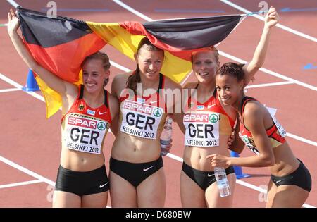 Leena Guenther (L-R), Anne Cibis, Verena Sailer and Tatjana Pinto of Germany celebrateafter women's 4x100 M Relay final at the European Athletics Championships 2012 at Olympic Stadium in Helsinki, Finland, 01 July 2012. The European Athletics Championships take place in Helsinki from the 27 June to 01 July 2012. Photo: Michael Kappeler dpa  +++(c) dpa - Bildfunk+++ Stock Photo
