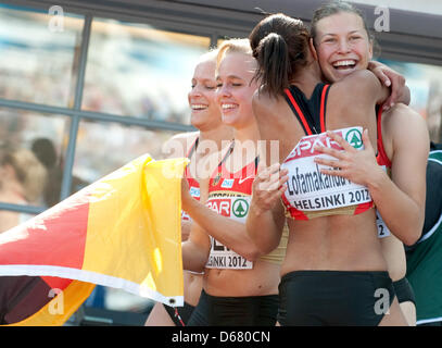 Verena Sailer (L-R), Leena Guenther, Tatjana Pinto and Anne Cibis of Germany celebrate after the women's 4x100 m Relay final at the European Athletics Championships 2012 at Olympic Stadium in Helsinki, Finland, 01 July 2012. The European Athletics Championships take place in Helsinki from the 27 June to 01 July 2012. Photo: Bernd Thissen dpa  +++(c) dpa - Bildfunk+++ Stock Photo