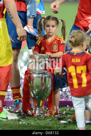 Nora, daughter of Spain's Fernando Torres plays with the trophy after the UEFA EURO 2012 final soccer match Spain vs. Italy at the Olympic Stadium in Kiev, Ukraine, 01 July 2012. Photo: Andreas Gebert dpa (Please refer to chapters 7 and 8 of http://dpaq.de/Ziovh for UEFA Euro 2012 Terms & Conditions) Stock Photo