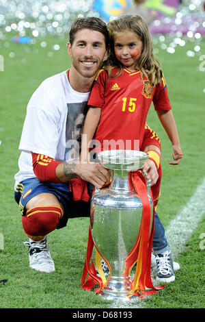 Spain's Sergio Ramos poses with his daughter and the Uefa cup after the UEFA EURO 2012 final soccer match Spain vs. Italy at the Olympic Stadium in Kiev, Ukraine, 01 July 2012. Spain won 4-0. Photo: Revierfoto Stock Photo