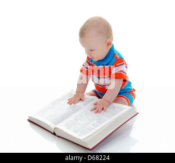 Little boy reads a big book Stock Photo