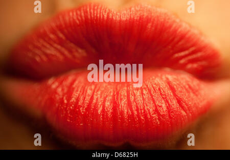 FILE - a file photo dated 10 February 2011 shows a woman doing a kiss in Cologne, Germany. 06 July 2012 is International kissing day, remembering the simple pleasures associated with kissing. Photo: Rolf Vennenbernd Stock Photo