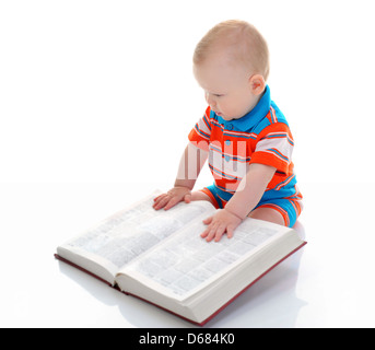 Little boy reads a big book Stock Photo